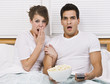 Photo: Surprised Young Couple Watching TV Surprised Young Couple Watching TV