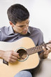 Photo: Man Playing an Acoustic Guitar Man Playing an Acoustic Guitar