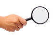 Photo: Female hand with magnifying glas isolated Female hand with magnifying glas isolated