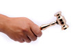 Photo: female hand with 24k gold gavel isolated female hand with 24k gold gavel isolated