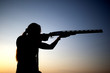 Shooting with a gun silhouette