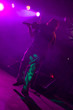 Fidler on the stage in pink light