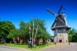 Dutch wind mill in a village