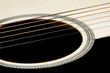An acoustic guitar close up An acoustic guitar close up
