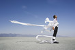 Man tangled in wind blown papers