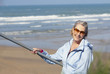 senior woman on outdoors stairs at the beach