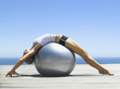 Woman working out with an exercise ball
