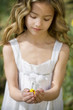 Young Girl Holding Easter Chick Toy