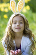 Young Girl Holding Easter Eggs Wearing Bunny Ears