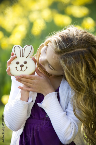 Photo: Young Girl Holding Chocolate Bunny Wearing Bunny Ears Young Girl Holding Chocolate Bunny Wearing Bunny Ears
