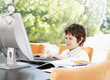 A young boy using a laptop