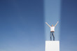 Man with a beam of light shining straight onto him
