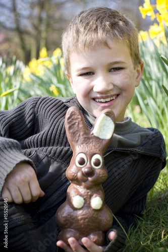 Photo: Portrait of Young Boy Holding Chocolate Easter Bunny Portrait of Young Boy Holding Chocolate Easter Bunny