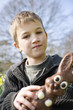 Portrait of Young Boy Holding Chocolate Easter Bunny