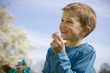 Young Boy Eating Chocolate Easter Egg