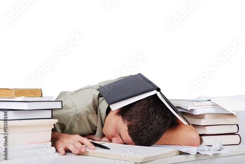 Photo: Young man fallen asleep after long reading Young man fallen asleep after long reading