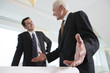 Photo: View of businesspeople discussing in an office. View of businesspeople discussing in an office.