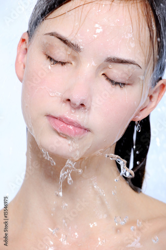 Photo: Semale face with stream of water on her face Semale face with stream of water on her face