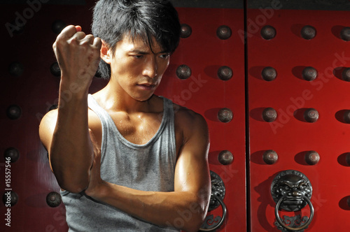 Photo: Young Asian Man training Martial Arts Young Asian Man training Martial Arts
