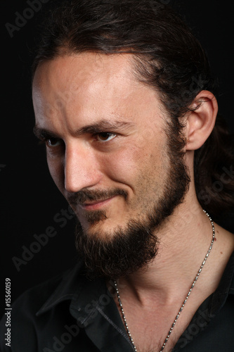 Photo: Side portrait of young man with goatee Side portrait of young man with goatee