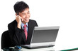 Photo: Asian businessman sharing good news with client over phone Asian businessman sharing good news with client over phone