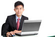 Photo: Portrait of successful Asian businessman at desk with laptop Portrait of successful Asian businessman at desk with laptop
