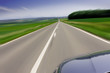 Fast moving car on road Fast moving car on road