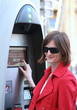 Young woman paying the parking fee