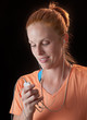 Woman adjusting mp3 player