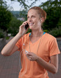Woman talking on phone while holding mp3 player