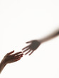 Hands reaching out to each other