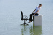 A woman on her desktop on top of water