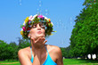 woman blowing bubbles
