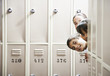 Students peeking around lockers