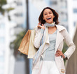Young happy woman with shopping bags