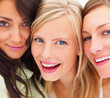 Closeup portrait of smiling young friends