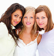 Portrait of smiling young girls isolated on white background