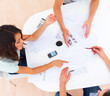 Woman sitting with her colleagues and discussing work