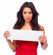 Portrait of a smiling beautiful woman holding a white board