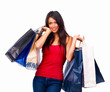 Closeup of a girl holding shopping bags isolated on white