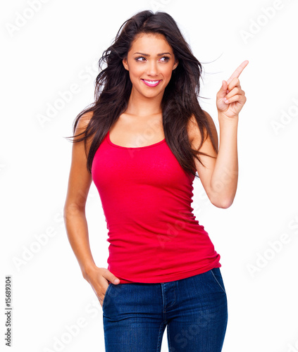 Photo: Happy young girl in red top standing against isolated white Happy young girl in red top standing against isolated white