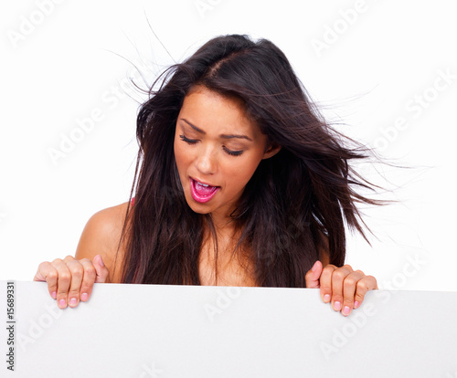 Photo: Portrait of a happy girl looking down, isolated on white Portrait of a happy girl looking down, isolated on white