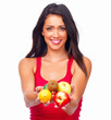 Happy young lady holding out fruits isolated on white