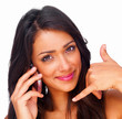 Smiling girl gesturing while speaking holding over cellphone