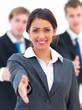 Smiling young businesswoman gesturing