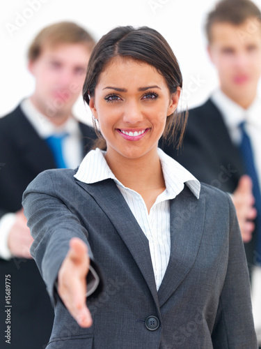 Photo: Smiling young businesswoman gesturing Smiling young businesswoman gesturing