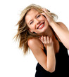 Attractive young woman with hand in hair, smiling, portrait.