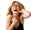 Attractive young woman with hand in hair, laughing.