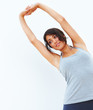 Young girl exercising isolated on white background