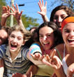 teenage fans screaming and reaching out for a celebrity